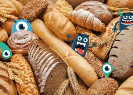 Gezeichnete kleine Monster, die sich hinter Brot verstecken